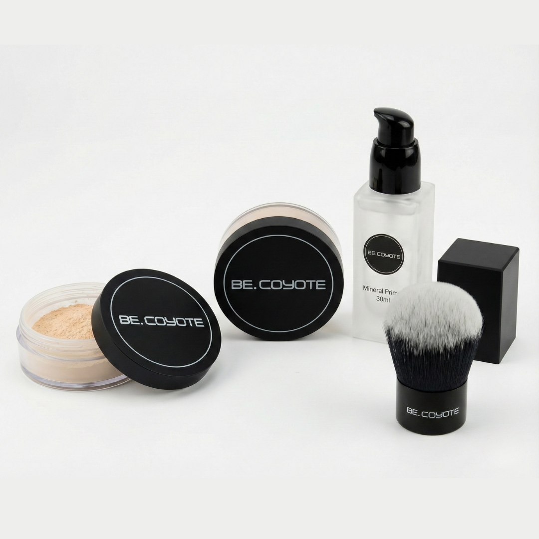 Makeup products including powders, a bottle, and a brush with 'BE COYOTE' branding on a white background.